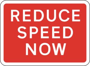 red reduce speed now road sign for sale