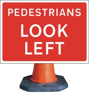 pedestrians look left road sign