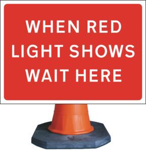 when red lights show wait here sign